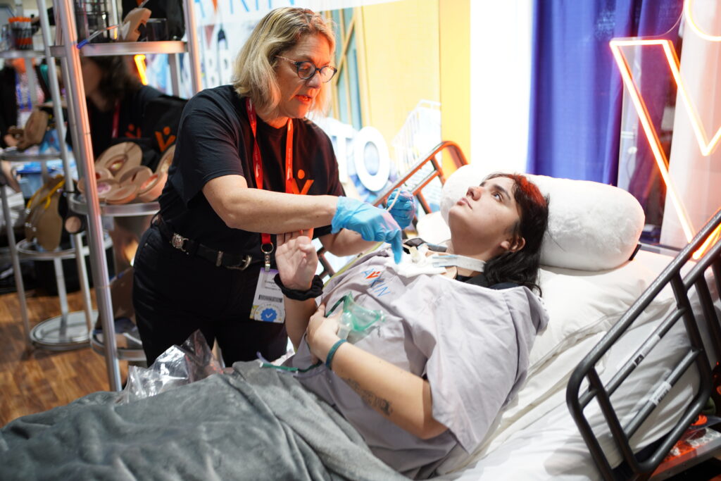 Amy Cowperthwait suctioning Avtrach patient at IMSH 2024